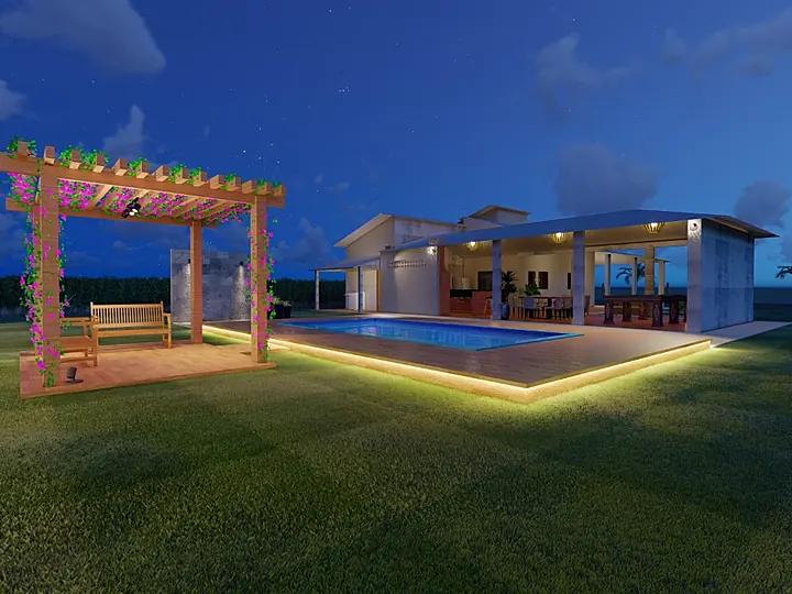 Área de lazer à noite com pérgola, piscina iluminada e casa ao fundo